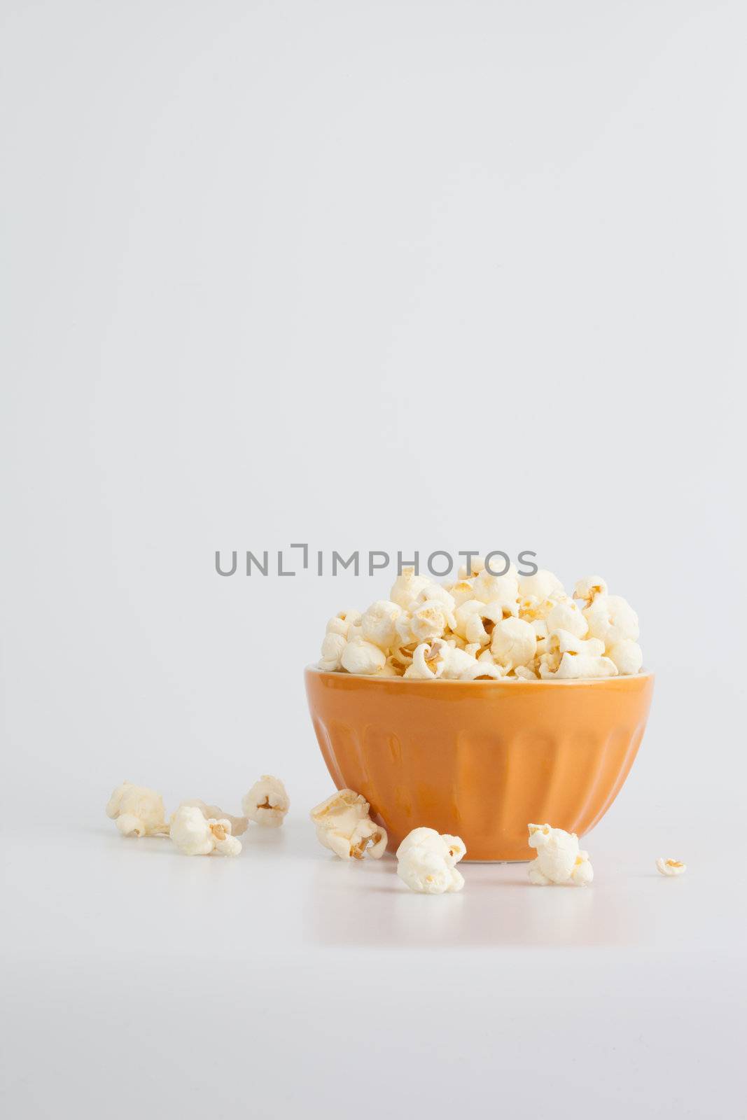 Orang popcorn bowl on a white background