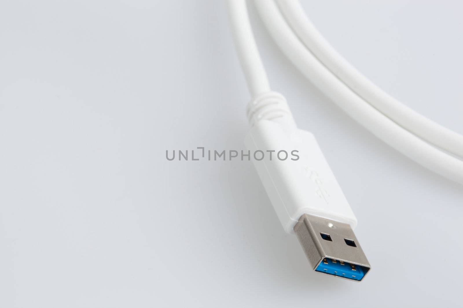 White USB Cable on a white backrgound