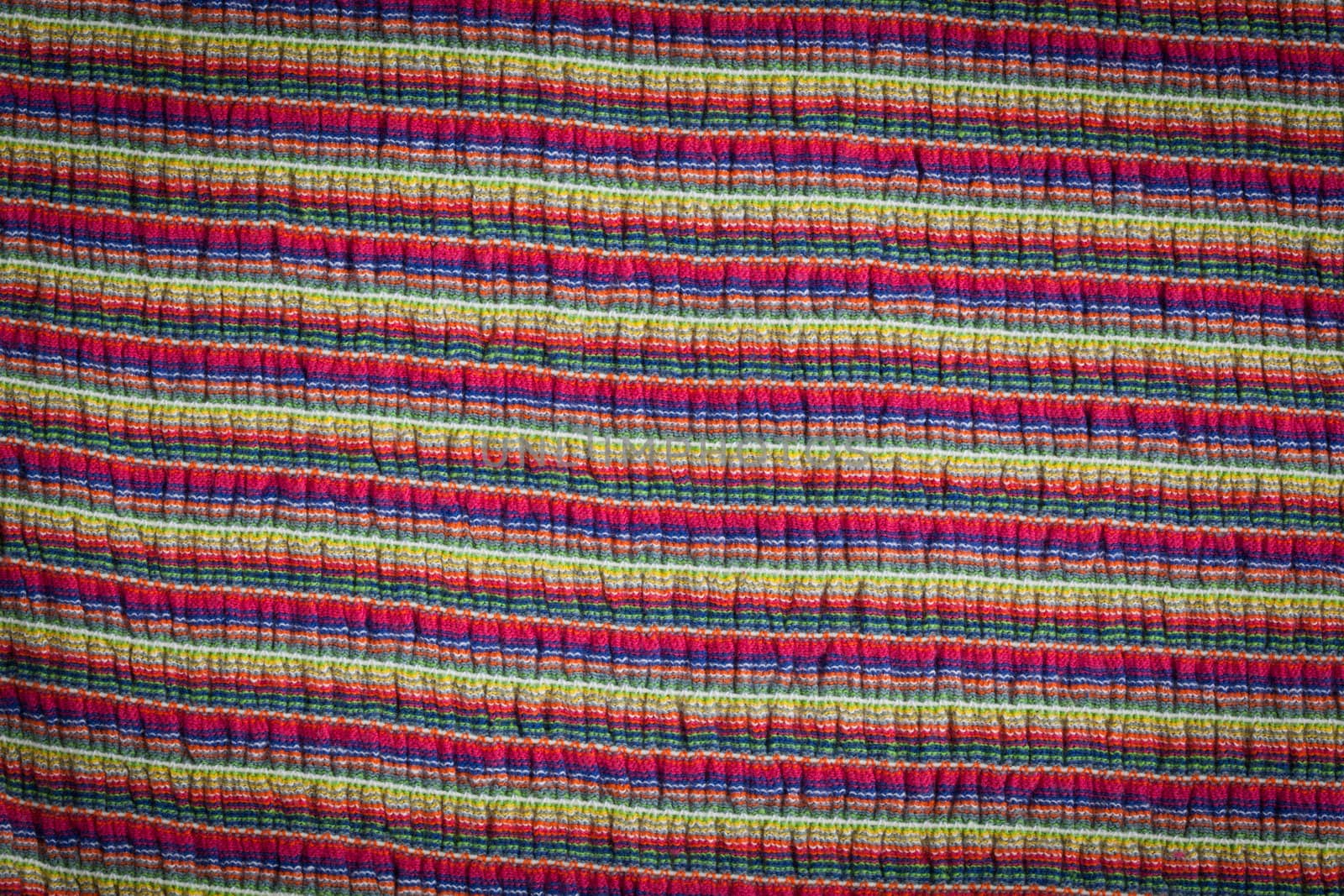 Multi colored striped texture and background close-up