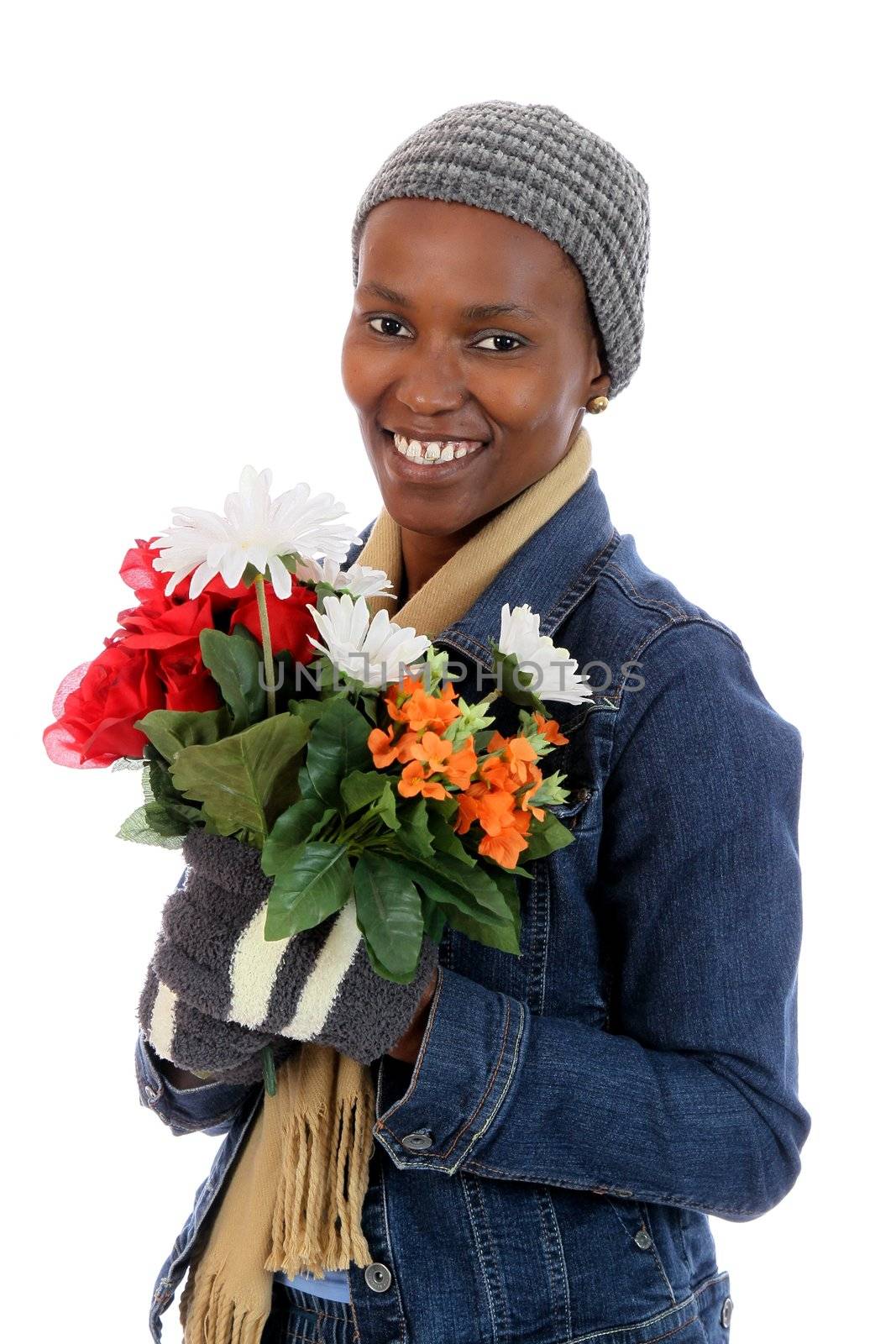 Lovely smiling African woman holding a bunch of flowers