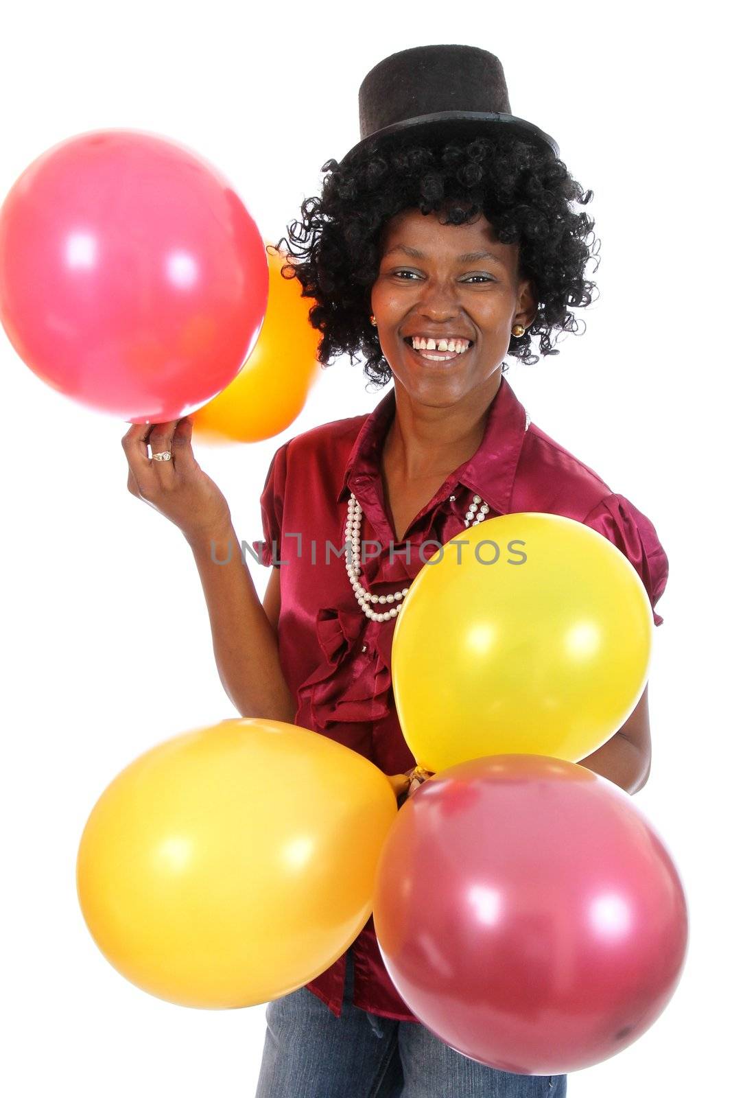 Happy African woman with part balloons and black hat