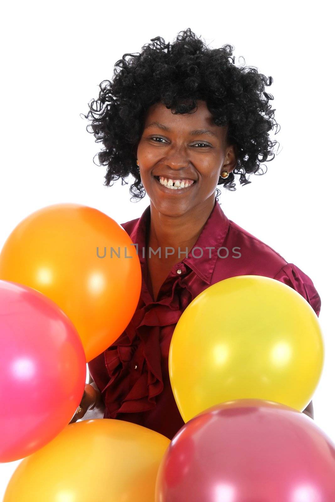 Lovely smiling and happy African woman with party baloons
