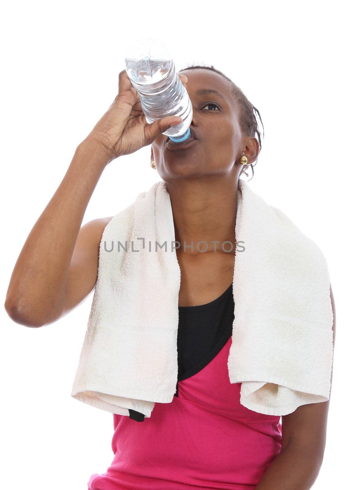 Young African woman drinking water after hard exercise session