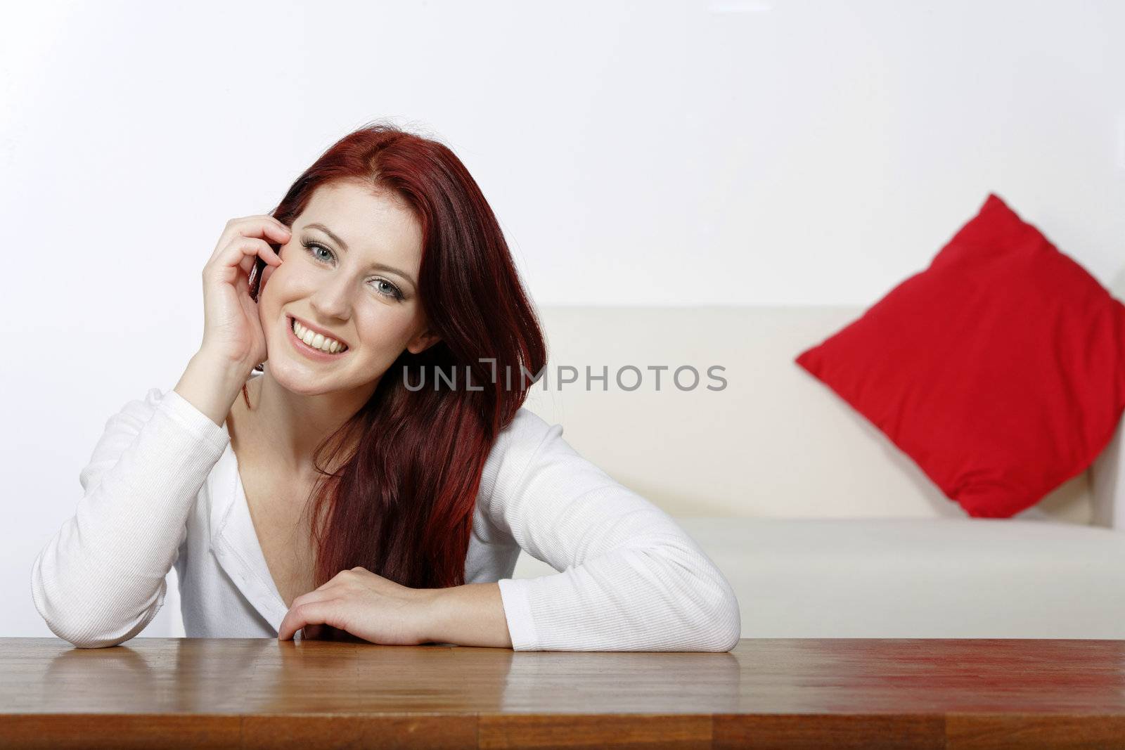 Young woman relaxing at home by studiofi