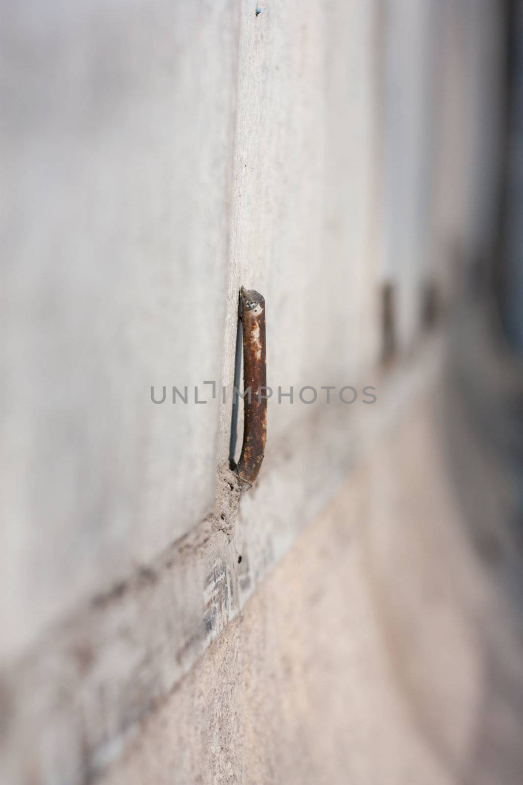 rusty pin on the concrete wall
