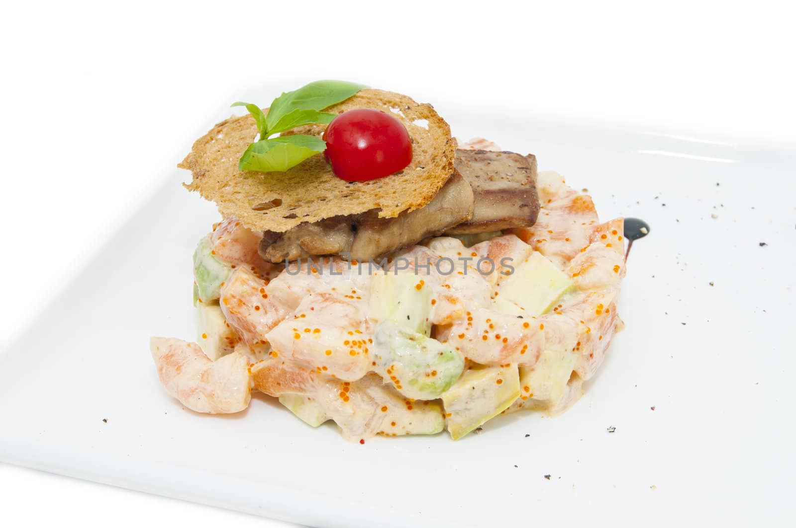 salad of fish and eggs in a restaurant on a white background