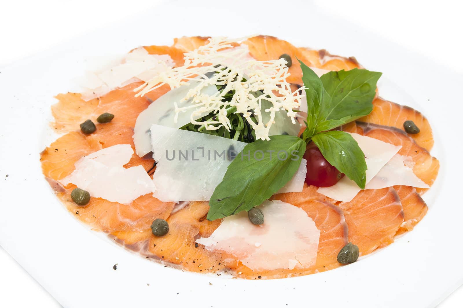 Carpaccio of salmon with fresh herbs and cheese