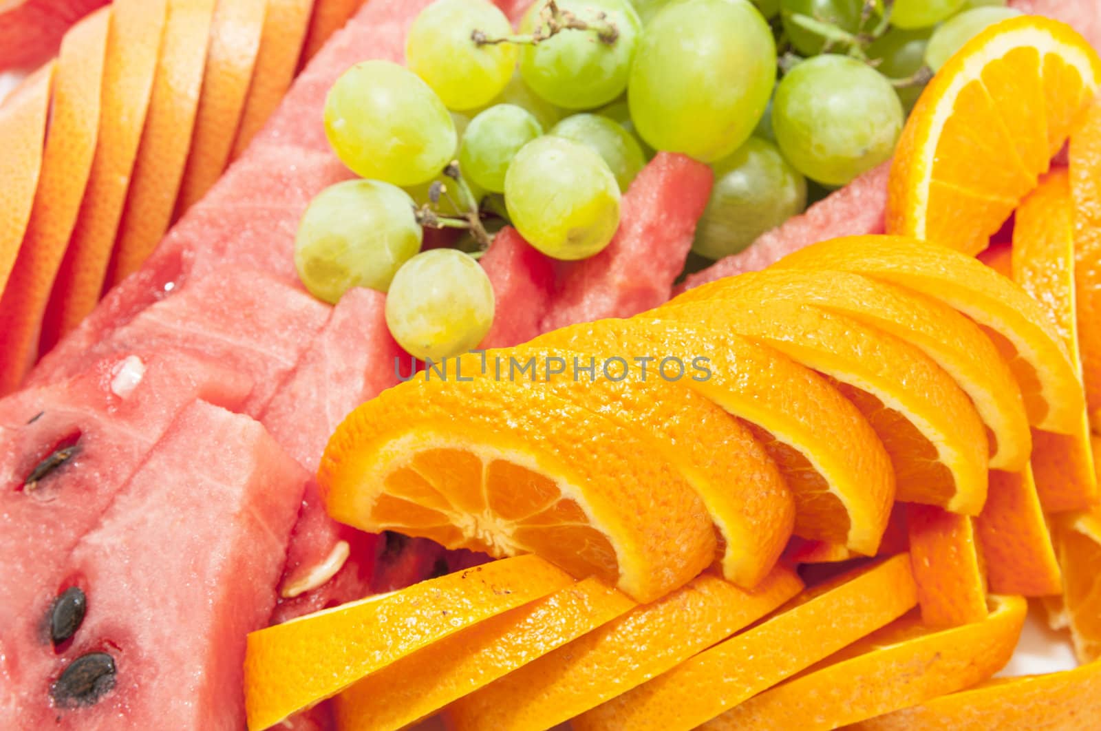 a plate of sliced fruit