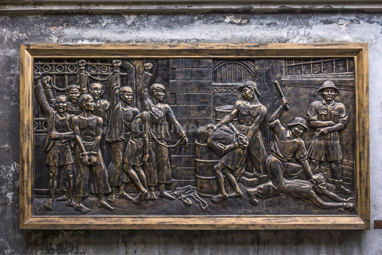 Mural in Hoa Lo Prison depicting brutal treatment by French. by Claudine