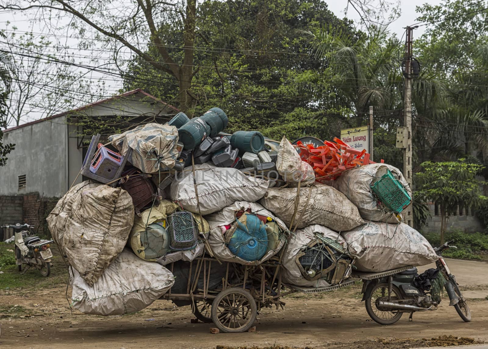 Vietnam Hanoi. Overloaded transport of voluminous stuff makes amazing proposition.