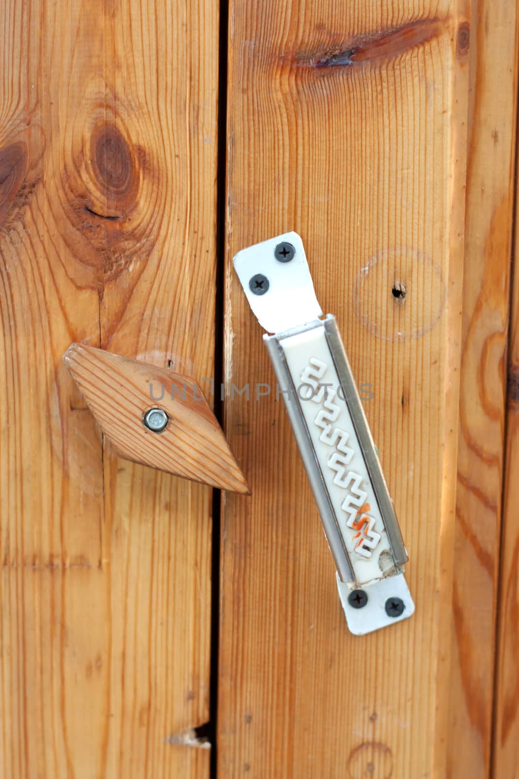wooden lock on the door by schankz