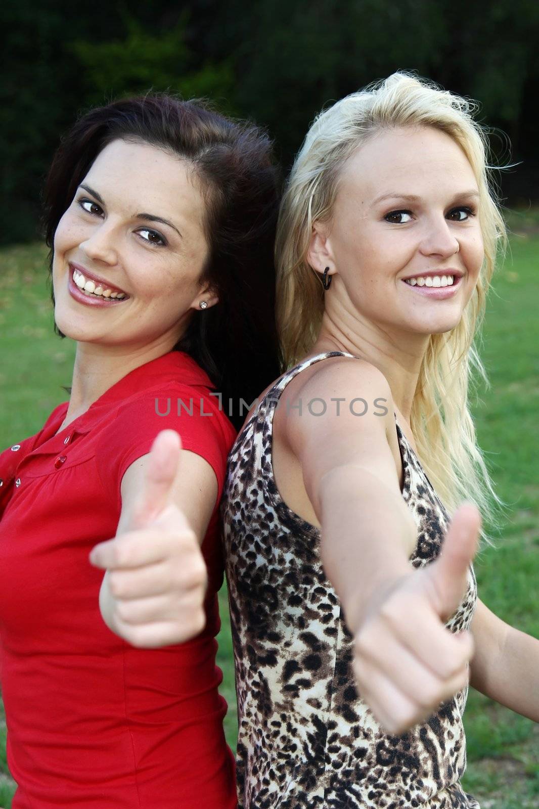 Gorgeous Women Showing Thumbs Up by fouroaks