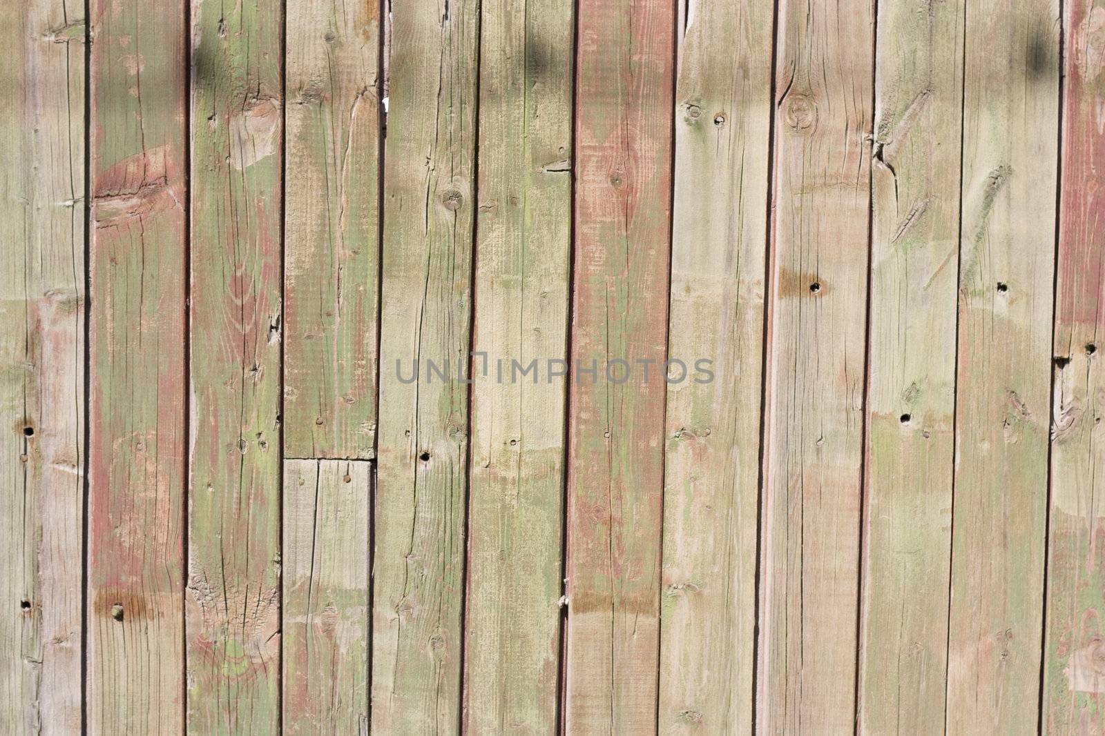 Close up of gray wooden fence panels  by schankz