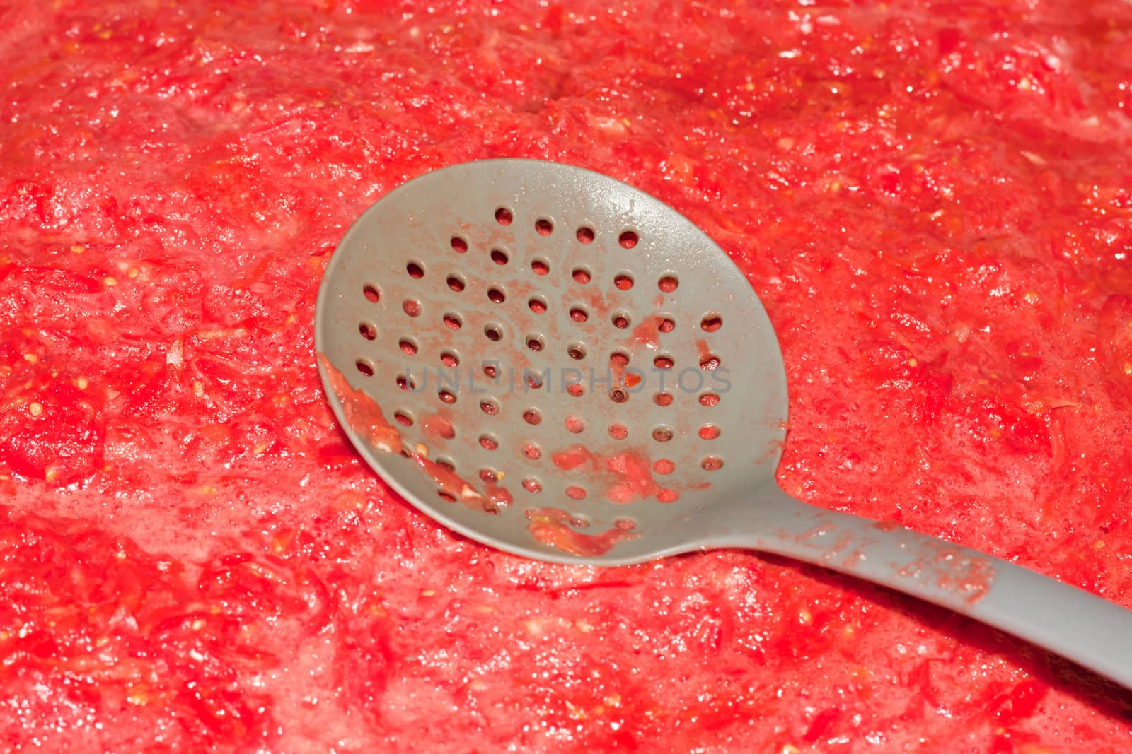 tomato sauce with a spoon