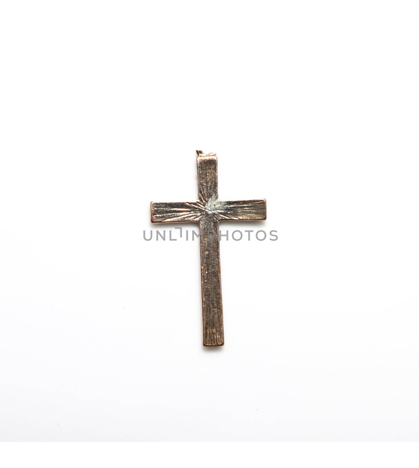 old bronze cross on a white background