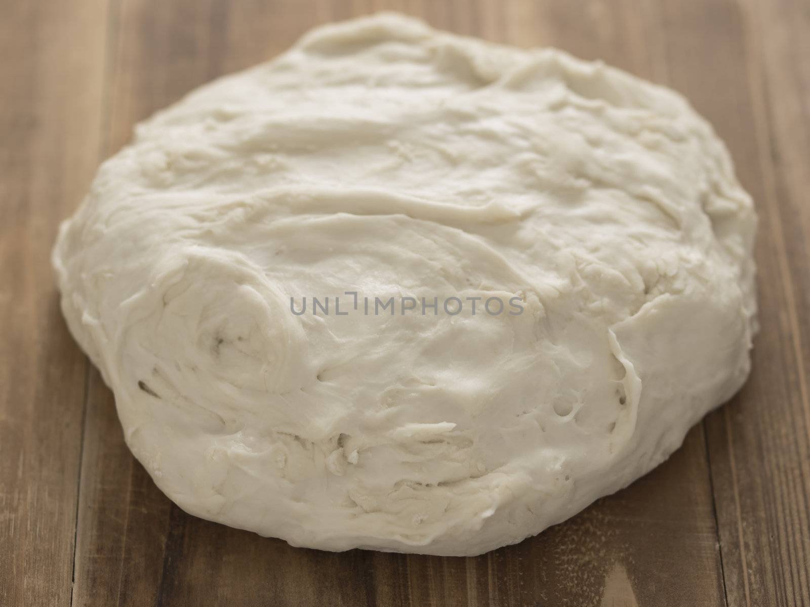 close up of flour dough on table