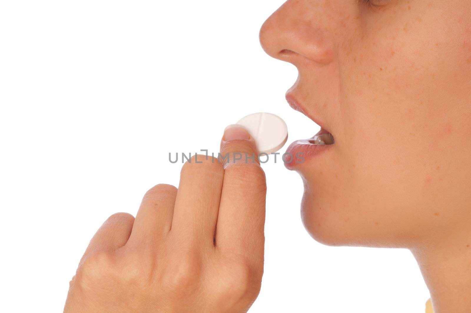 woman taking narcotic in a shape of white pill