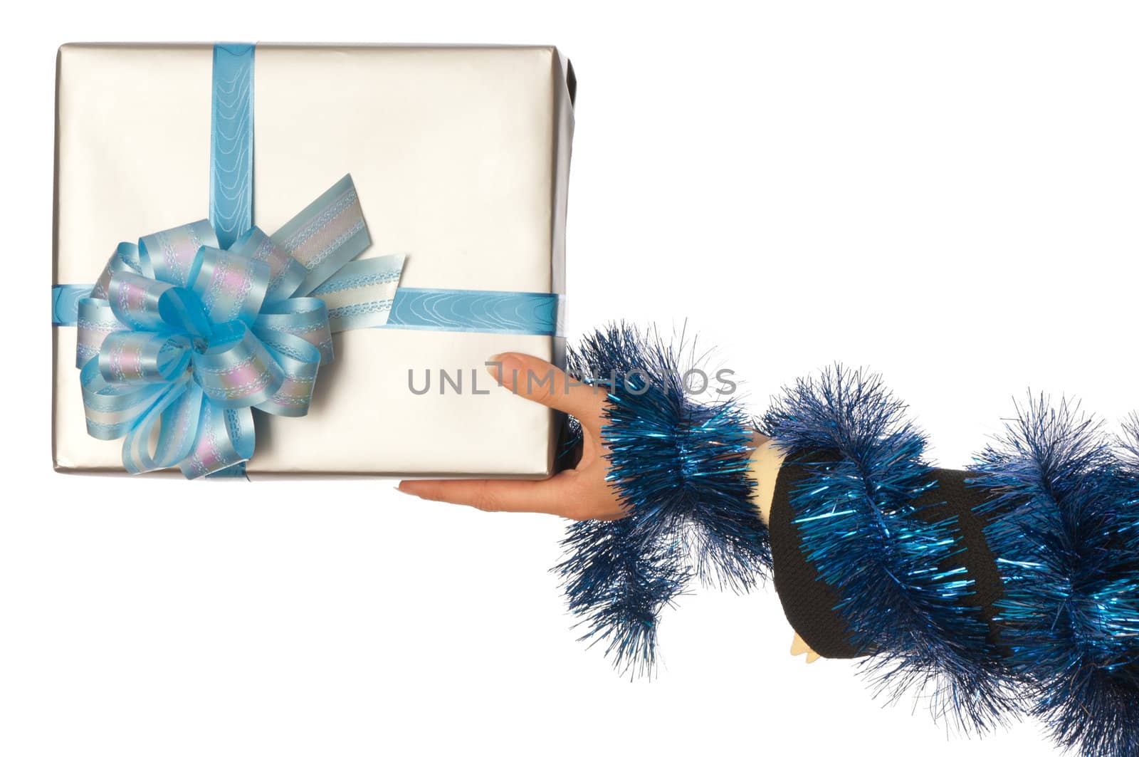 woman giving a silver box with blue bow as a gift for christmas