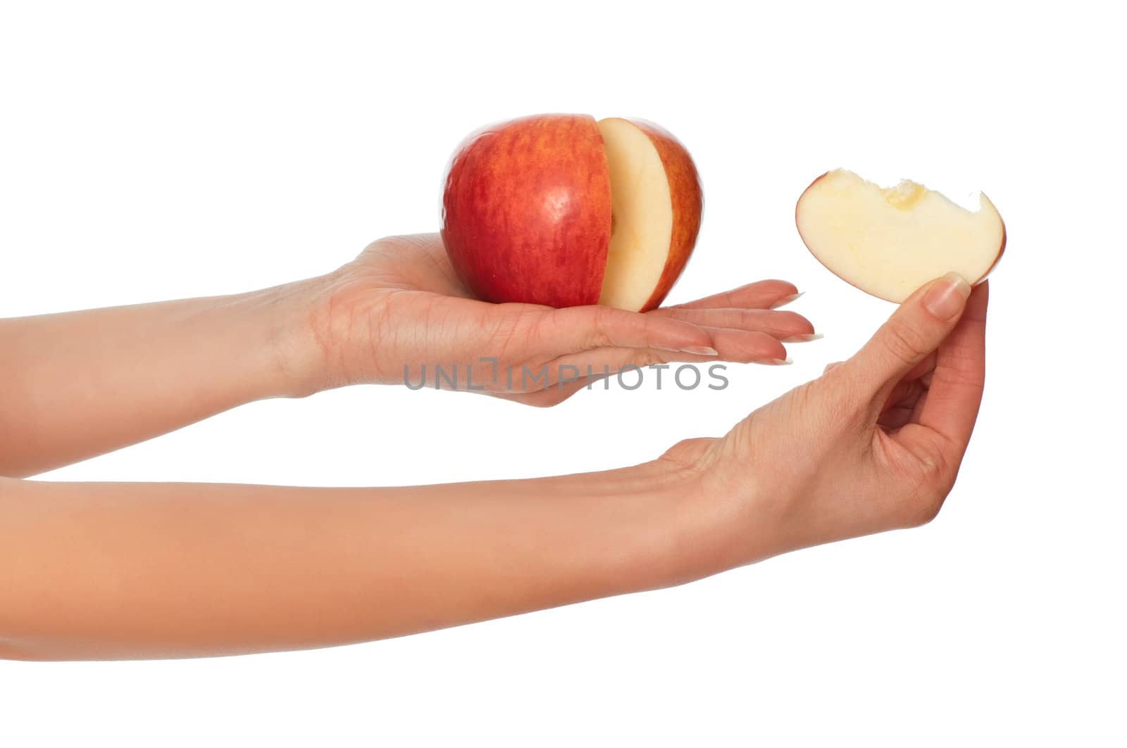 woman holding in the hand one fresh red apple with a slice of apple