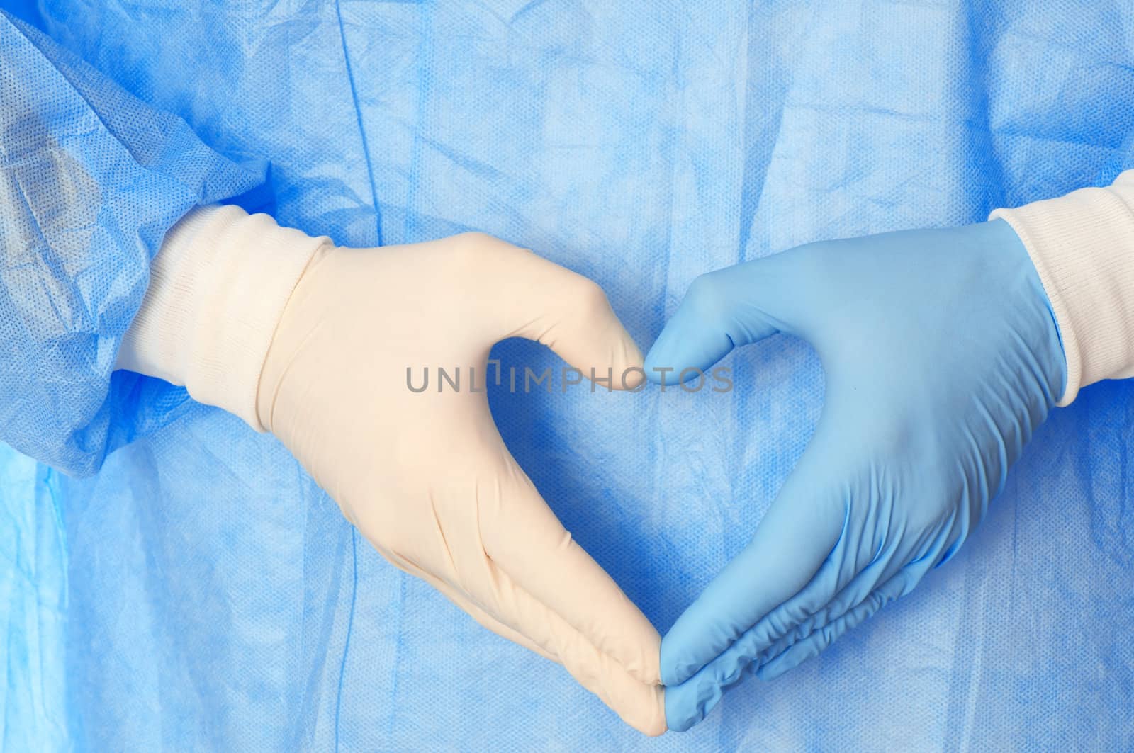 cardiologist in blue and white gloves saving life of all his patients