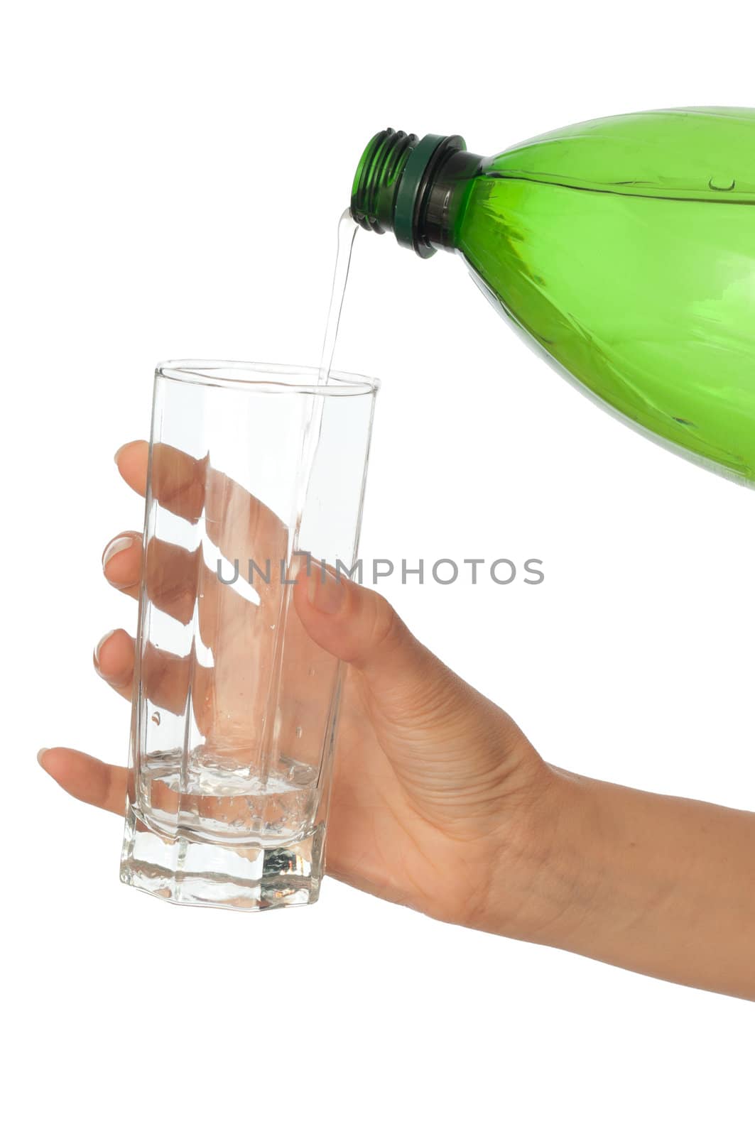 Woman pouring water to a glass from the bottle