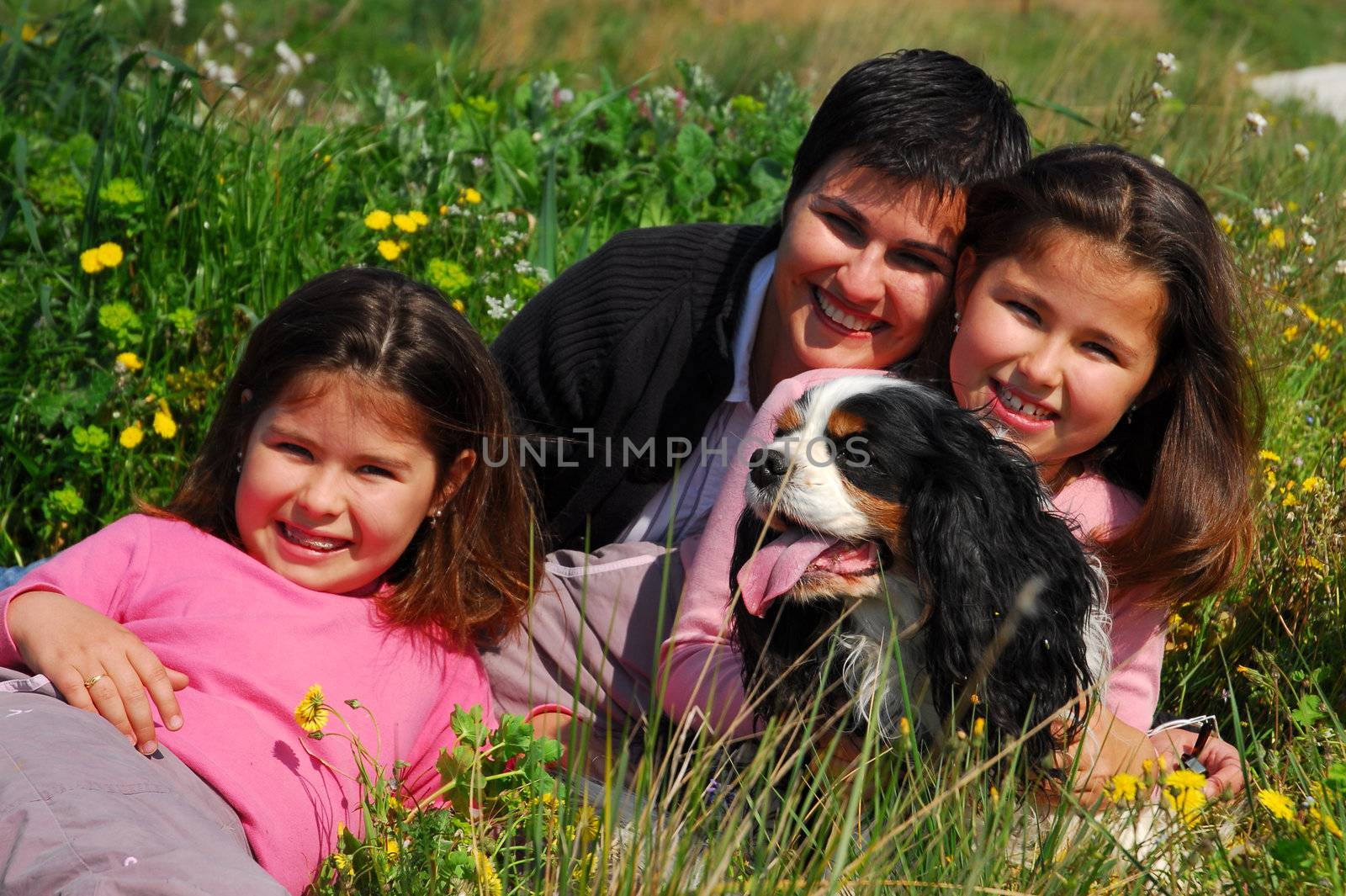 mother, twins sisters and little dog cavalier king charles