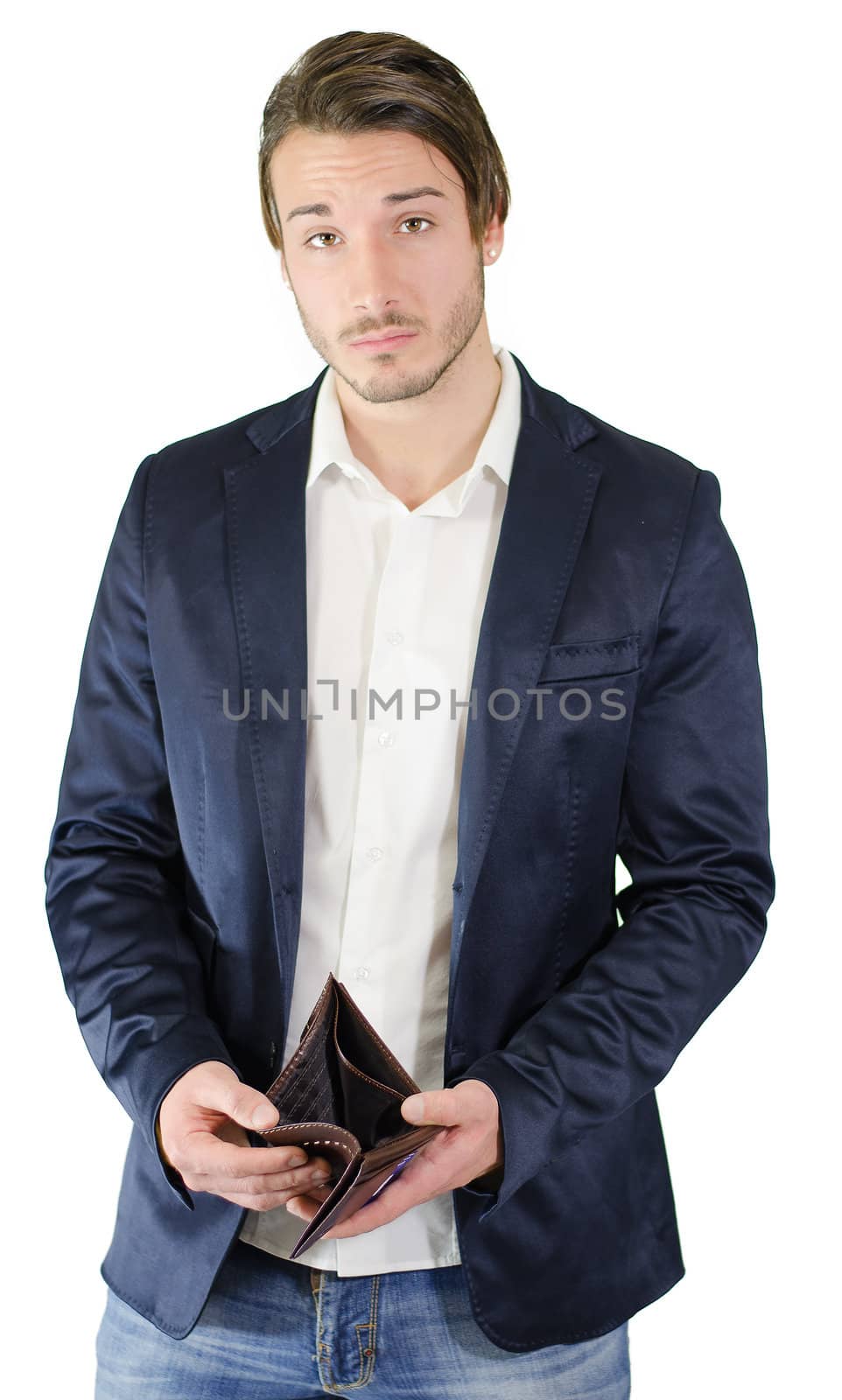 Broke young man showing empty wallet by artofphoto