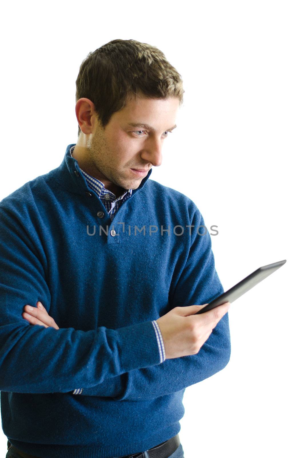 Young man reading ebook reader, isolated by artofphoto
