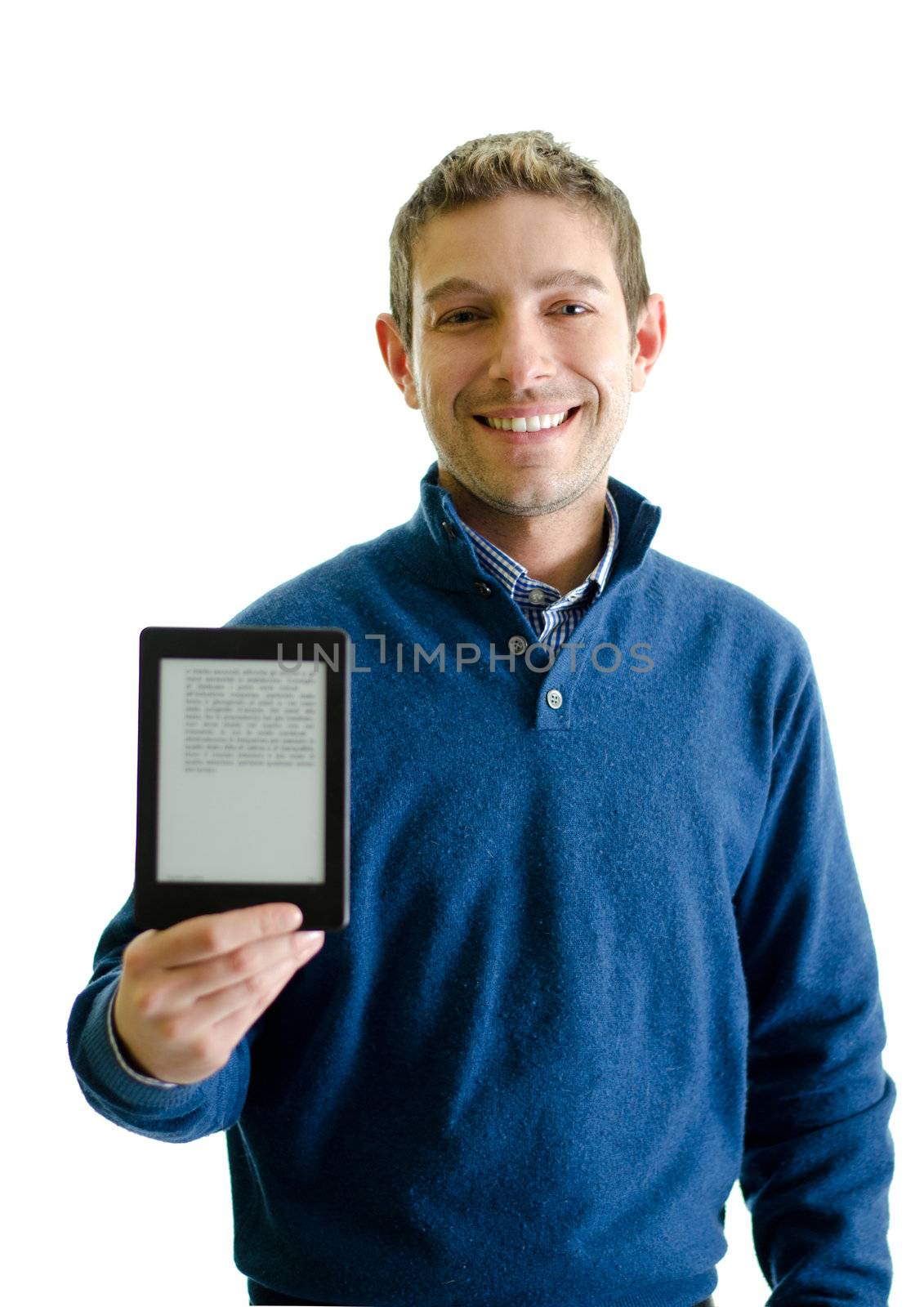 Young man with ebook reader (e-reader) in his hand, smiling. Isolated on white
