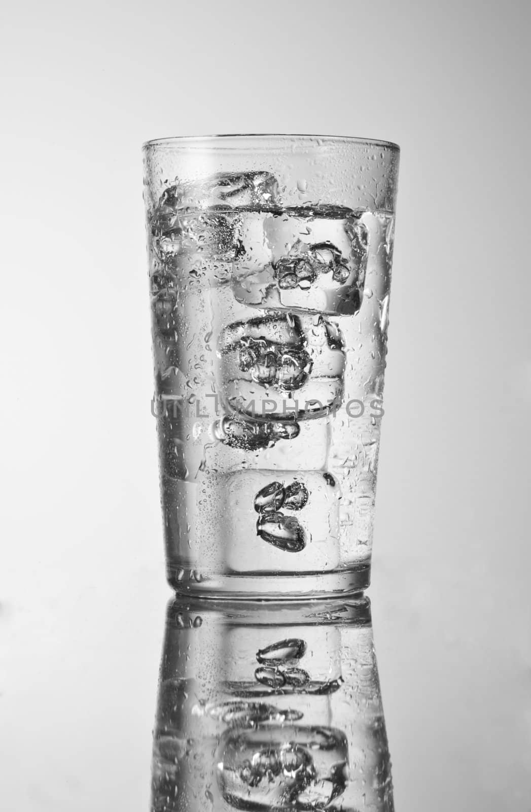 glass with pure cold water and ice