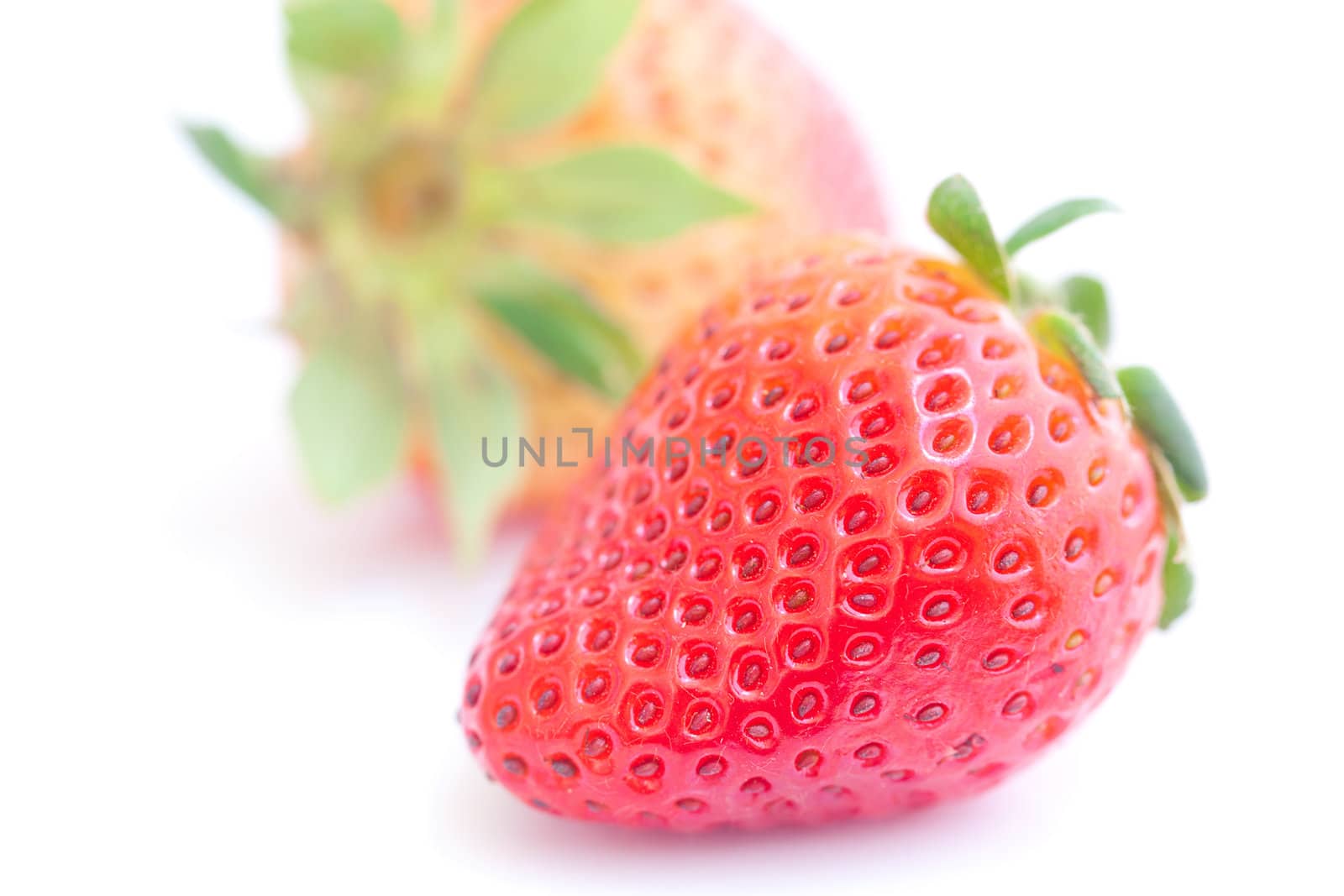 big red strawberry isolated on white by jannyjus
