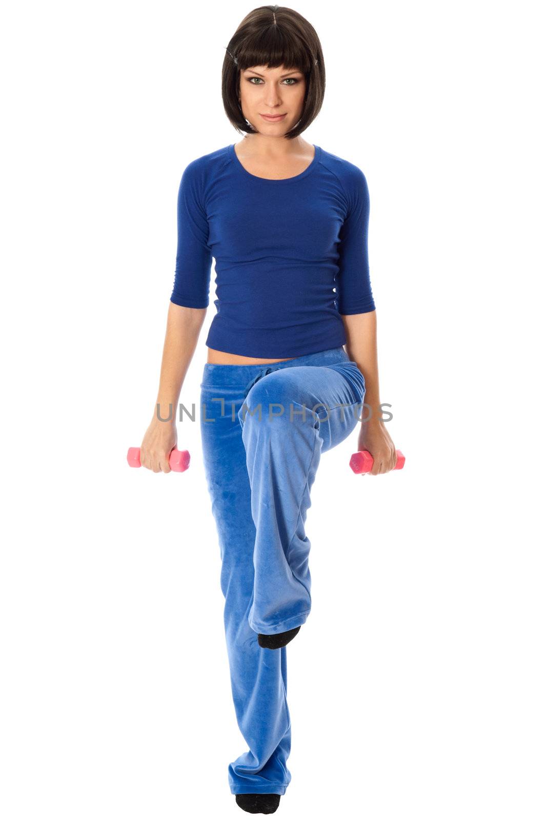 instructor showing to people exercises using dumbbells at gym