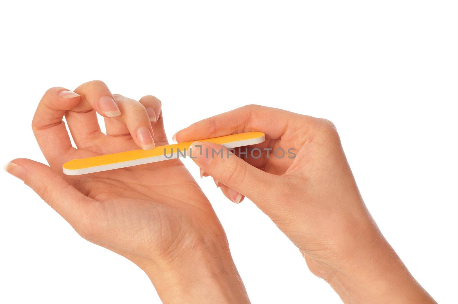 woman files her nails by emery board from manicure set