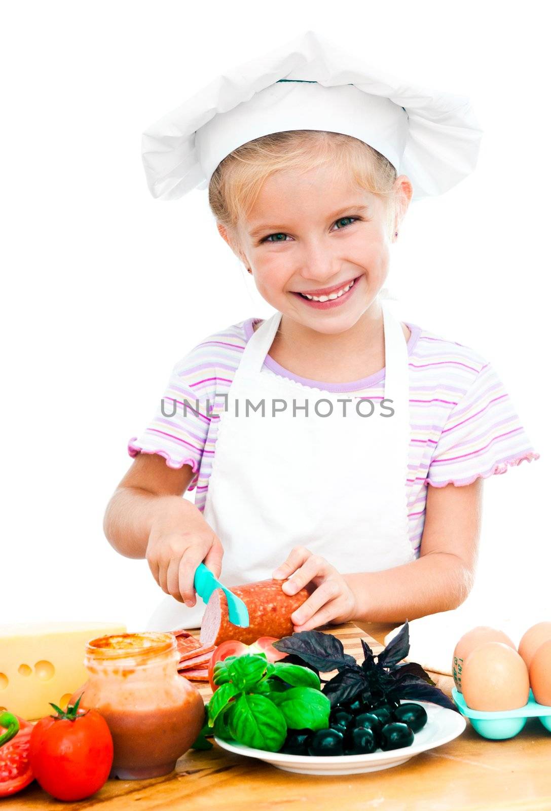 cute little girl little girl cuting sausage on a white