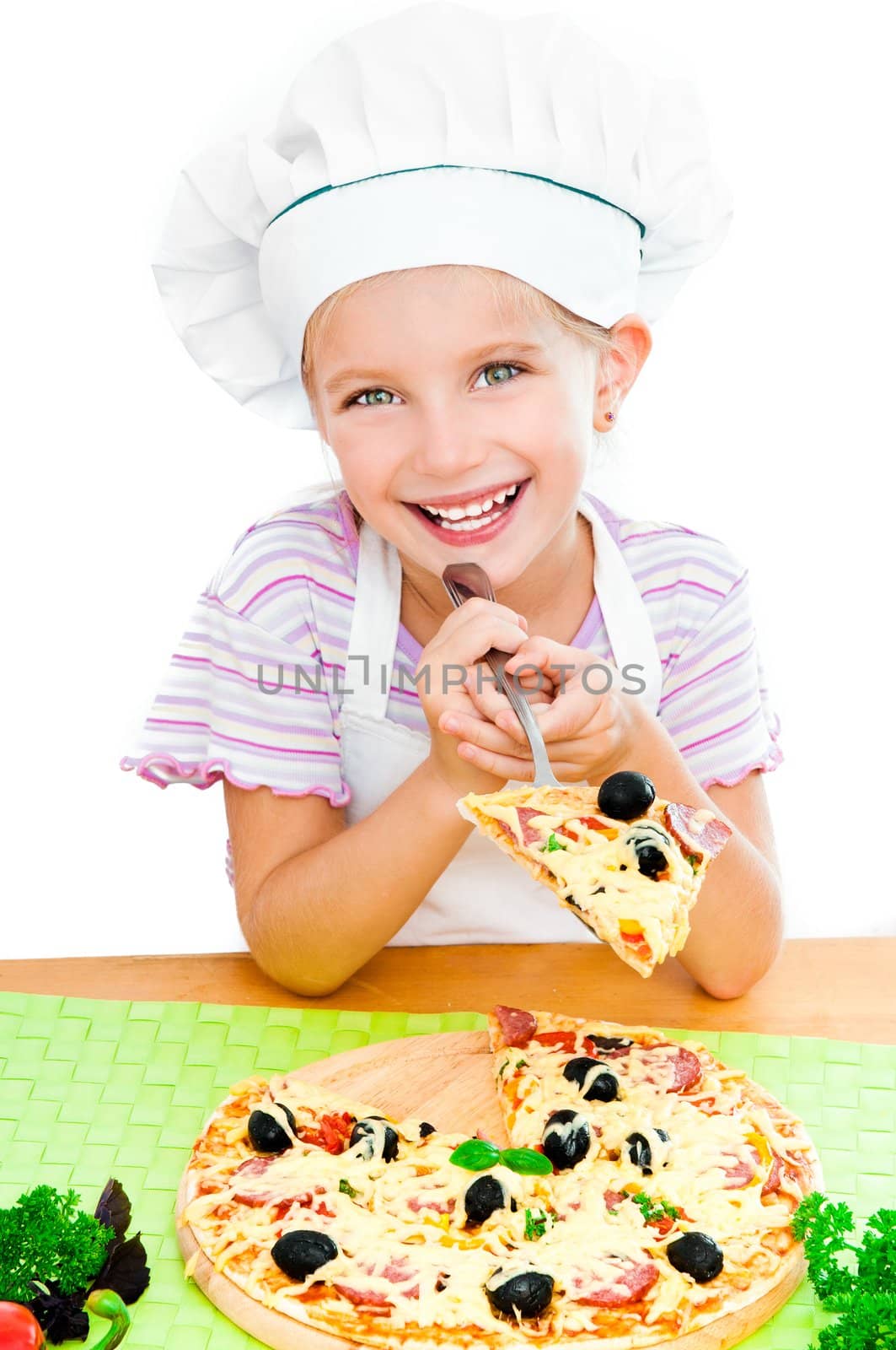 Smiling young girl with a pizza on a white background