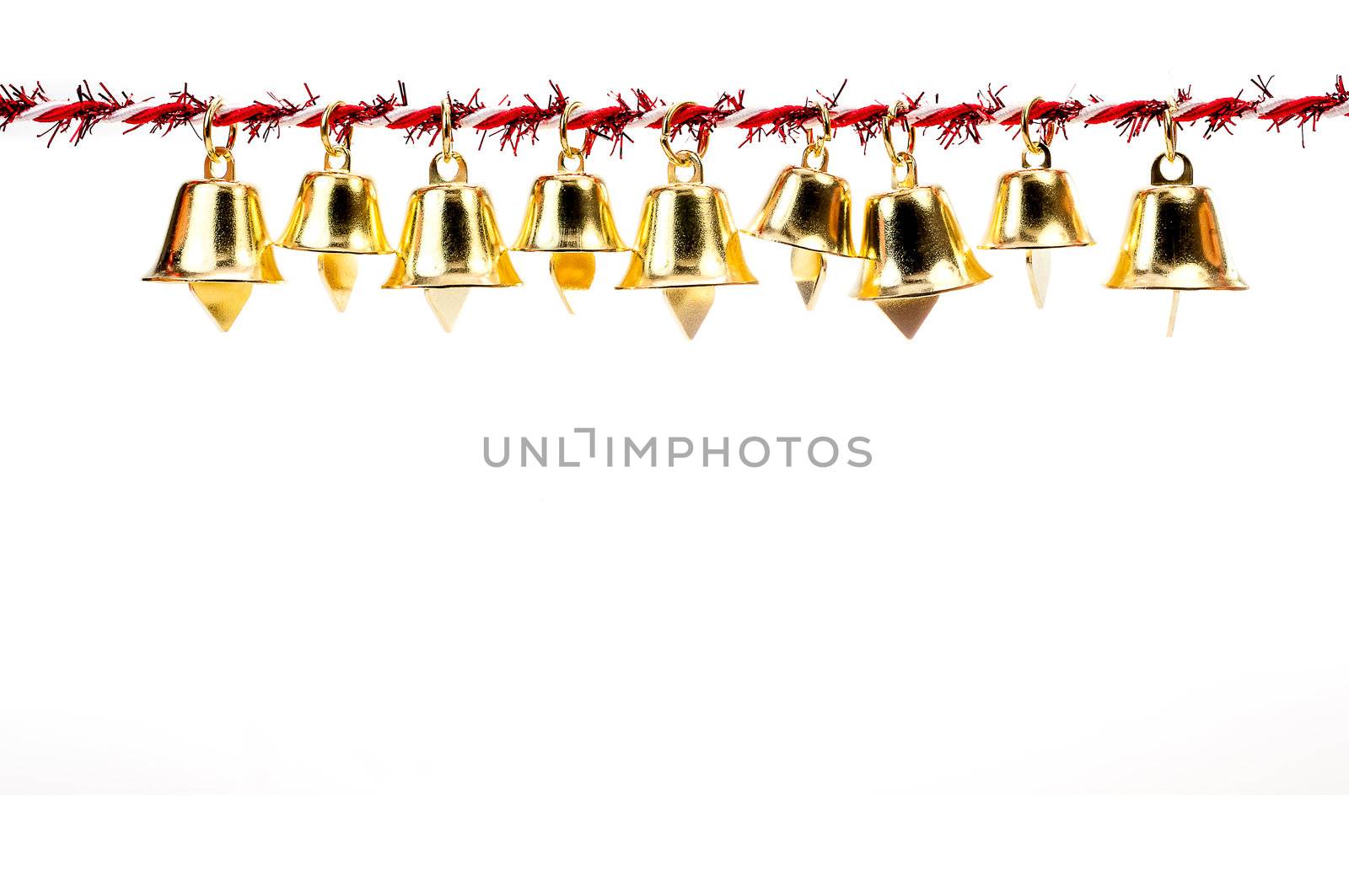 Golden bell holding ribbon rope isolate on white background