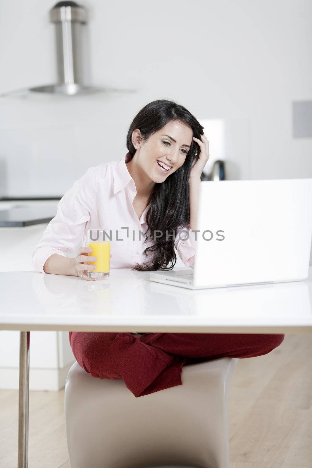 Girl chatting with friends on laptop by studiofi