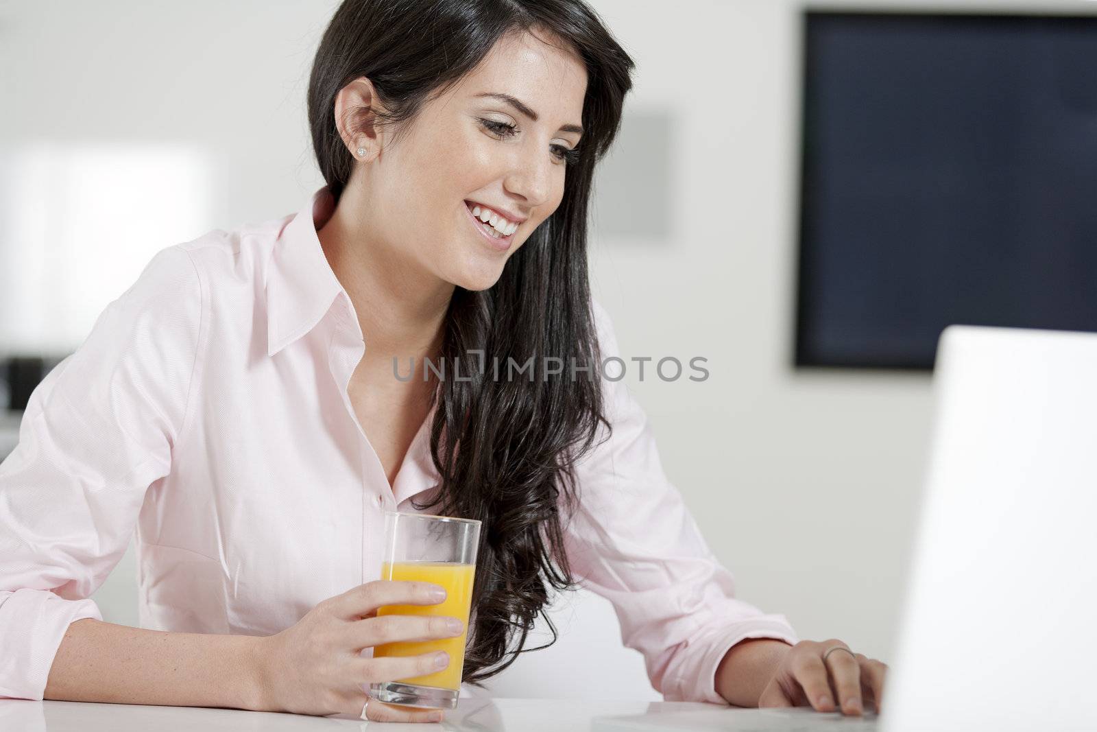 Girl using laptop at home to chat with friends