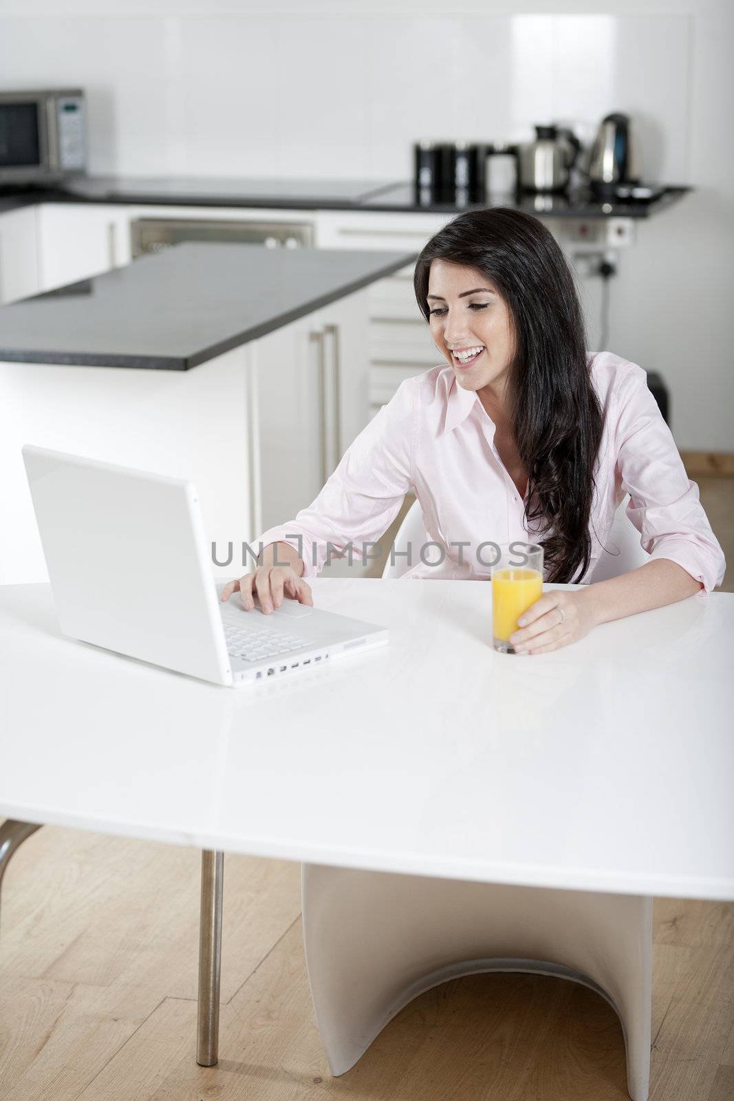 Girl using laptop at home to chat with friends