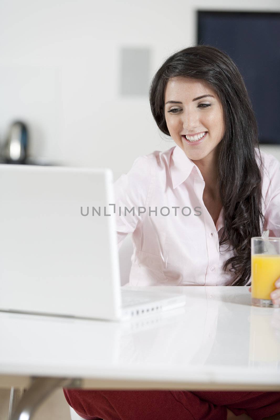 Girl chatting with friends on laptop by studiofi