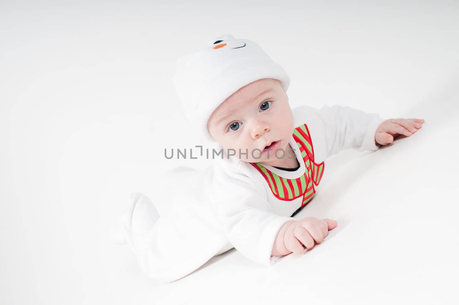 Baby in snowman costume on light background