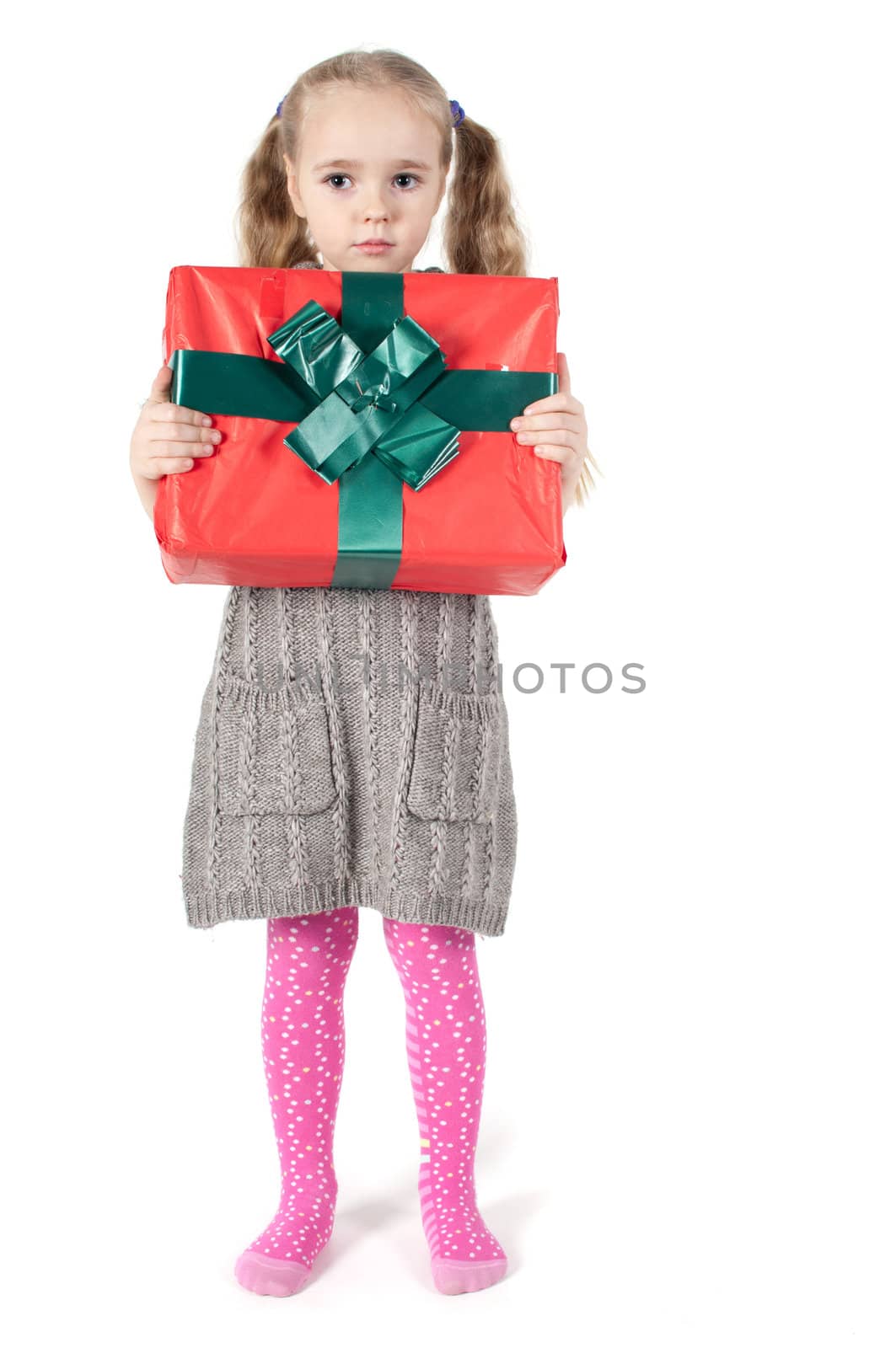 Beautiful girl with christmas present on white