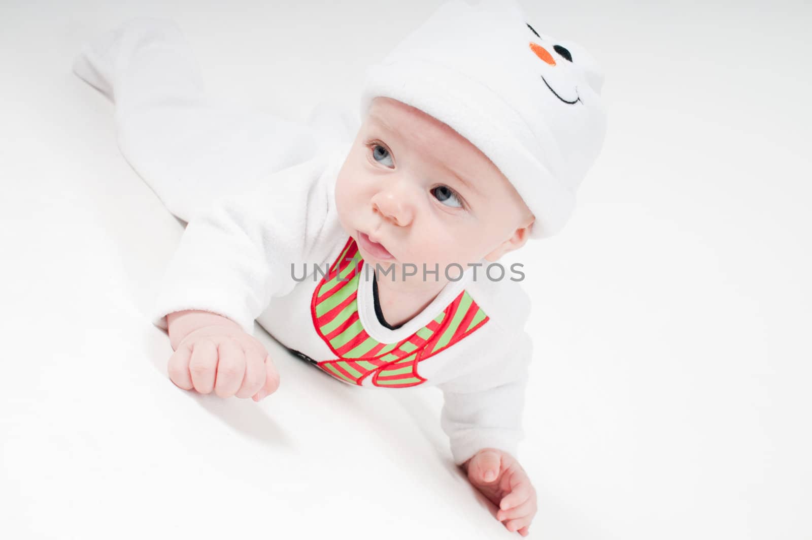 Cute baby boy in snowman costume on light background