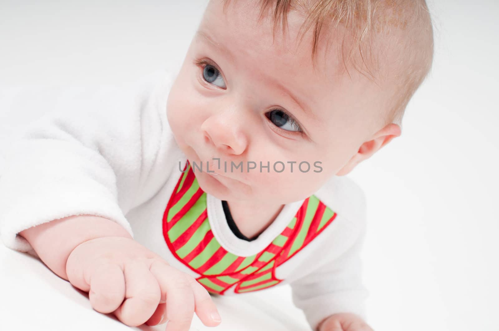 Closeup portrait of baby boy in snowman costume on light background