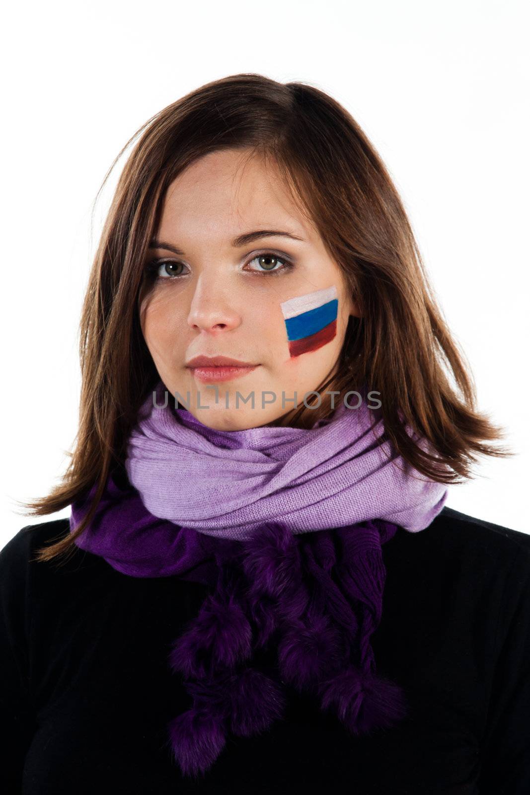 Photo of a young and beautiful woman with a painted face the Russian flag