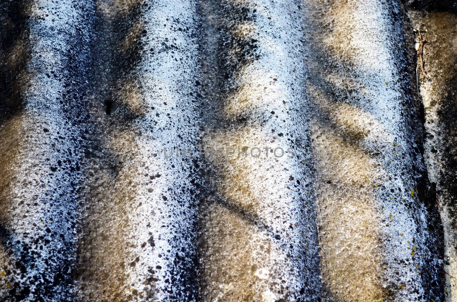 Background of old slate roofing plate texture and shadows on it.