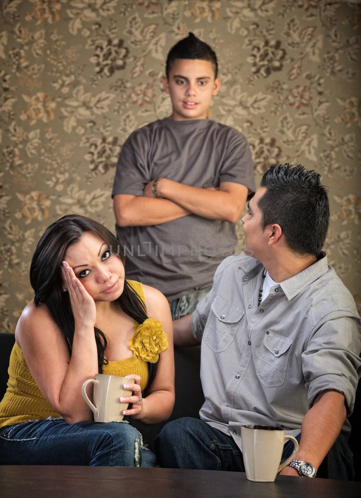 Teenager talking to annoyed parents sitting