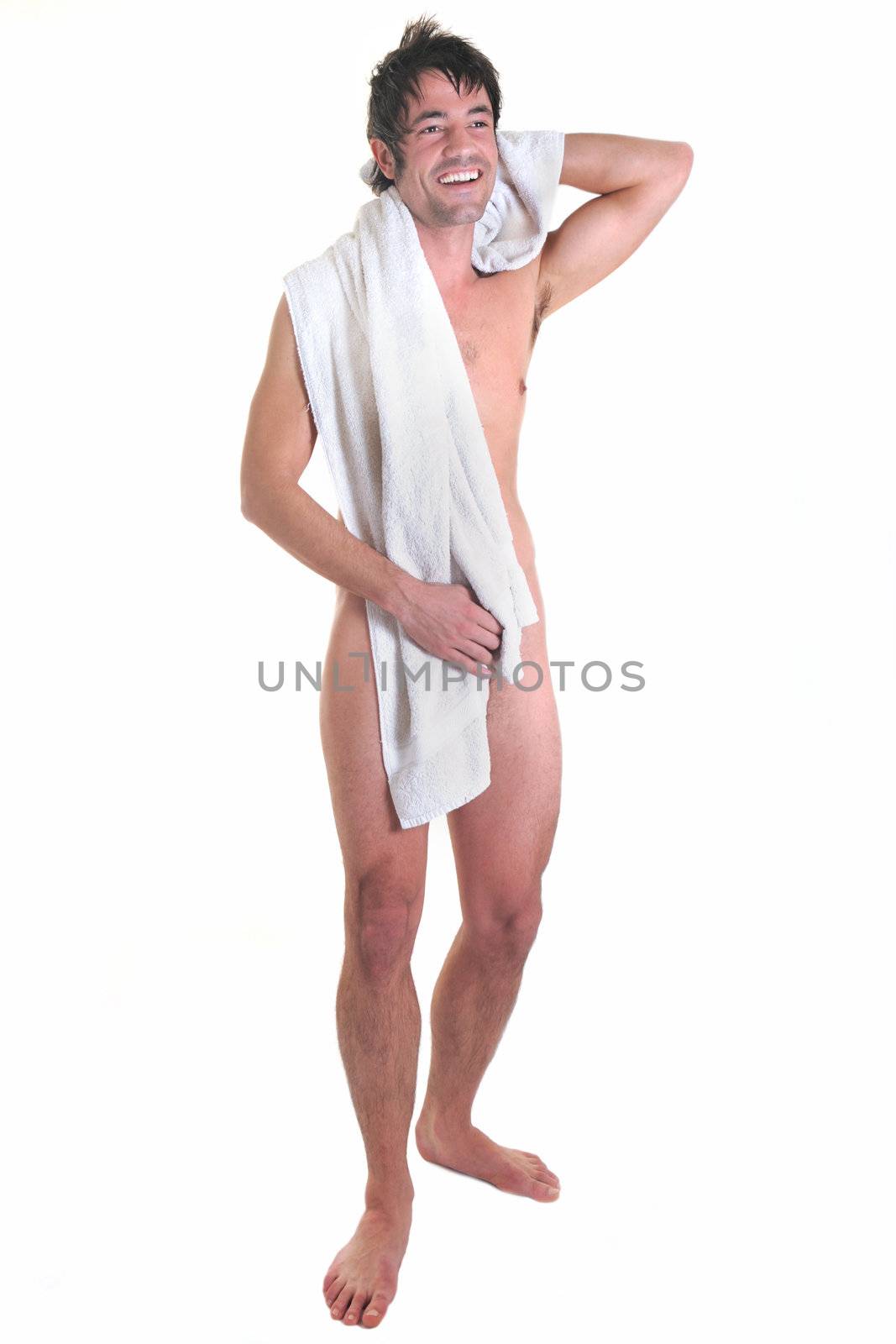 nude man with bath towel in front of white background