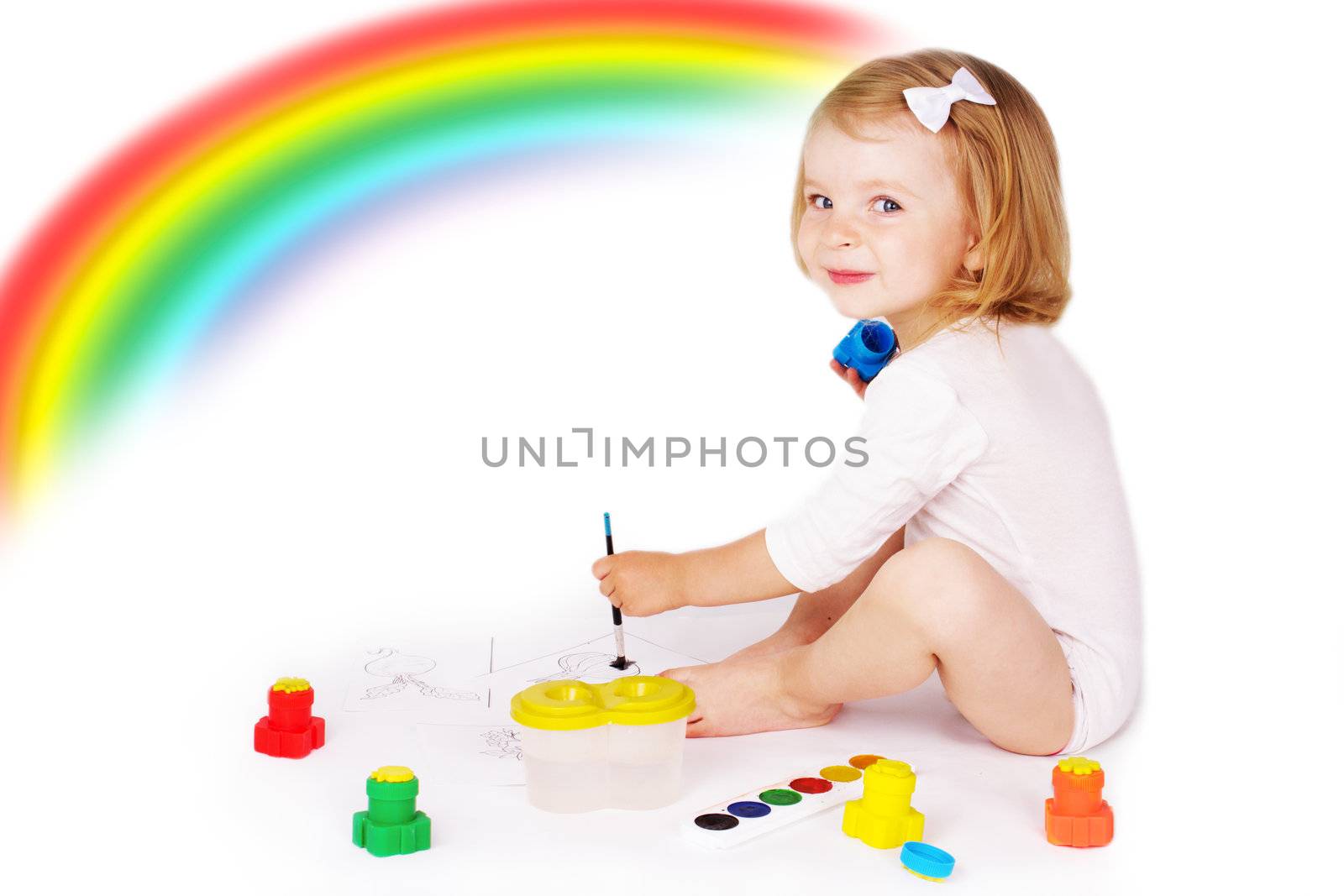 Pretty girl painting on floor isolated on white