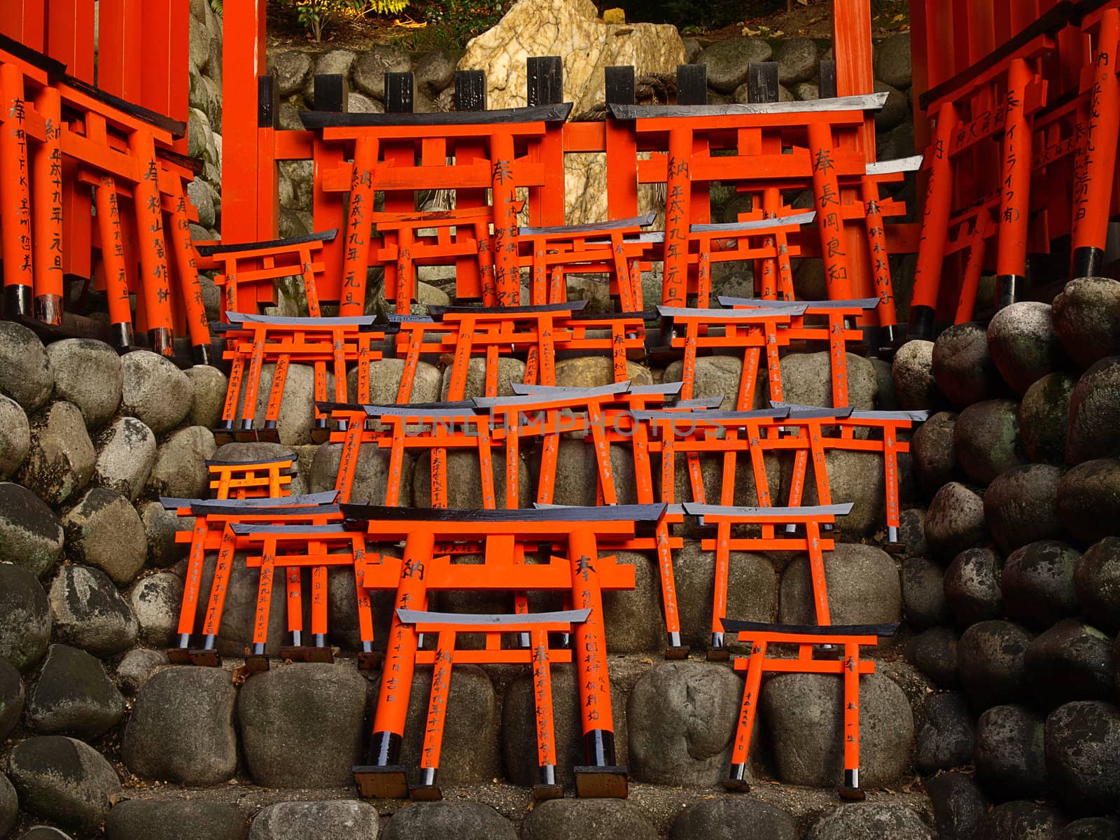 Little wooden torii gate at Fushimi Inari Shrine.